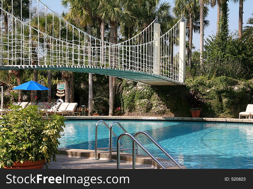 Resort pool with suspension bridge. Resort pool with suspension bridge