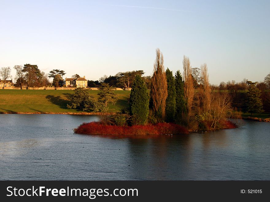 Autumnal lake shot with russet coloured foliage. Autumnal lake shot with russet coloured foliage