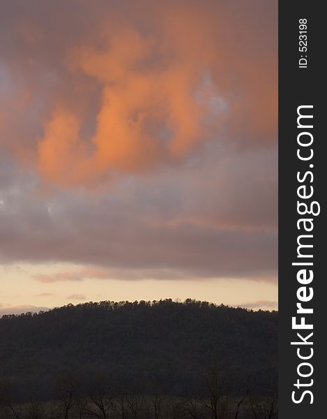 A storm moves over a hillside at sunset in Smoky Mountain National Park in Tennessee. A storm moves over a hillside at sunset in Smoky Mountain National Park in Tennessee