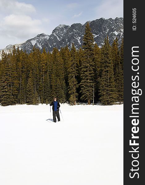 A person cross country-skiing in kanaskis country, canada. A person cross country-skiing in kanaskis country, canada.