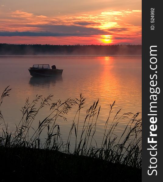 A misty sunrise on Fawcett Lake, Alberta.