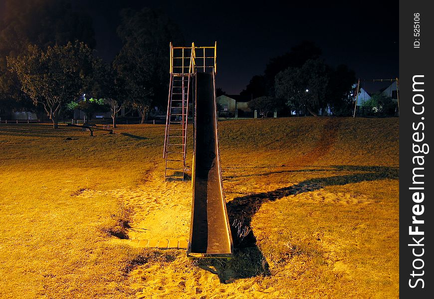 Urban park slide at night, front. Urban park slide at night, front.