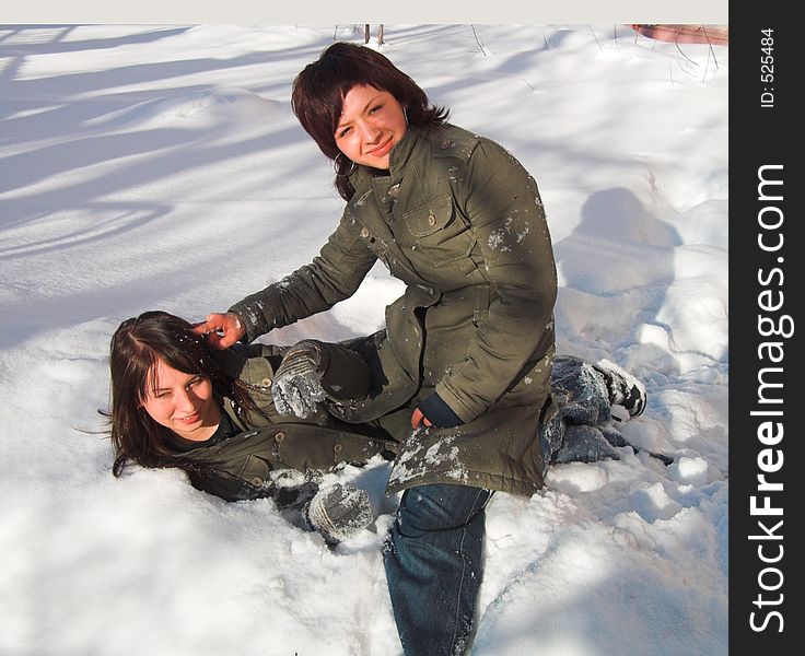 Girlfriends struggle in the snow. Girlfriends struggle in the snow