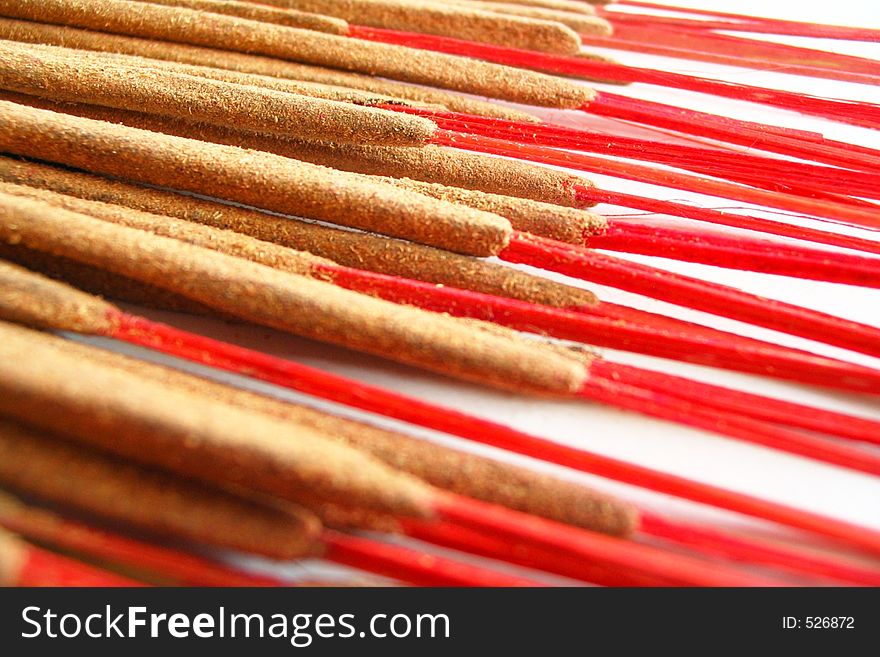 Hand-rolled Indian incense with red wood sticks.