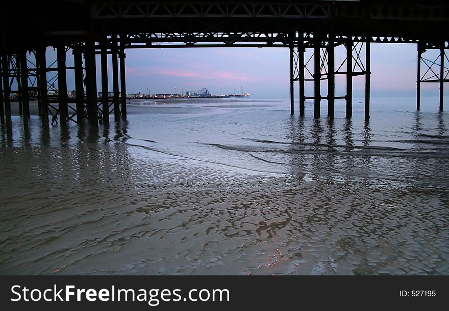 Blackpool pier and beach in the dusk