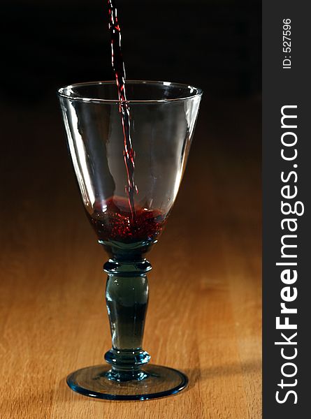 Red wine poured into a glass