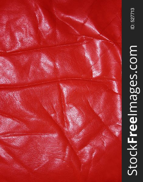 Wrinkled and worn red leather. Wrinkled and worn red leather