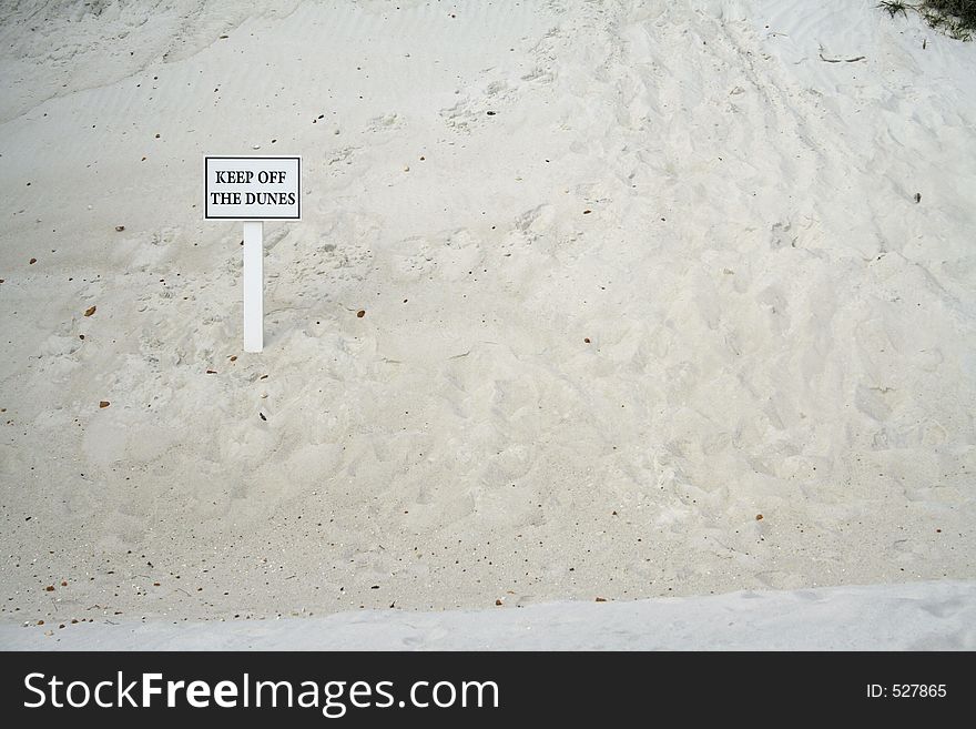 Sign on a dune saying Keep off the dunes horizontal with room for copy. Sign on a dune saying Keep off the dunes horizontal with room for copy