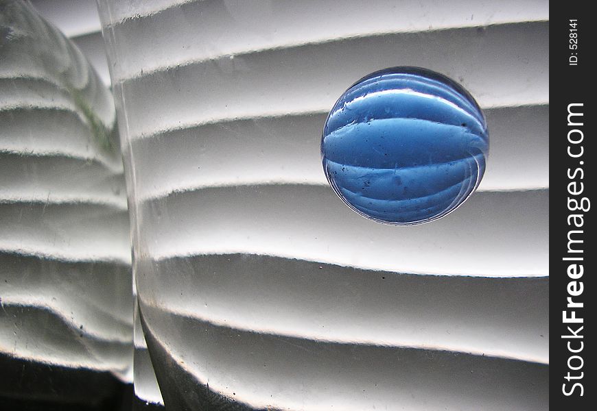 Still life with blue glass ball