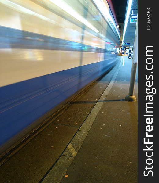 fast moving Speeding train at a station