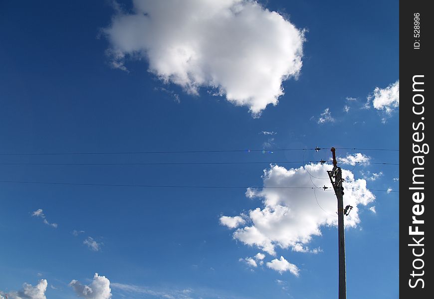 Clouds in the sky and the telephone pole