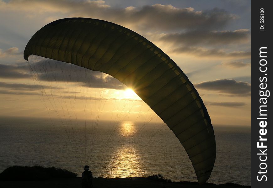Hang glider in sunset