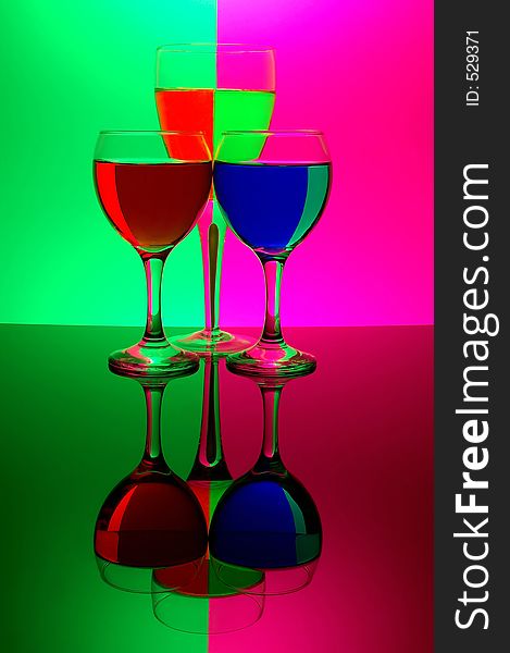 Three glasses on neon background
