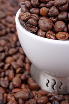 Cup Of Coffee Beans Royalty Free Stock Photos