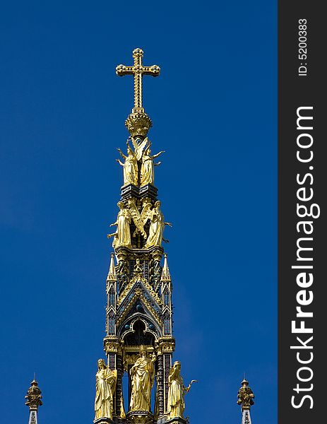 Christian golden cross in the top of the Albert Memorial, London.