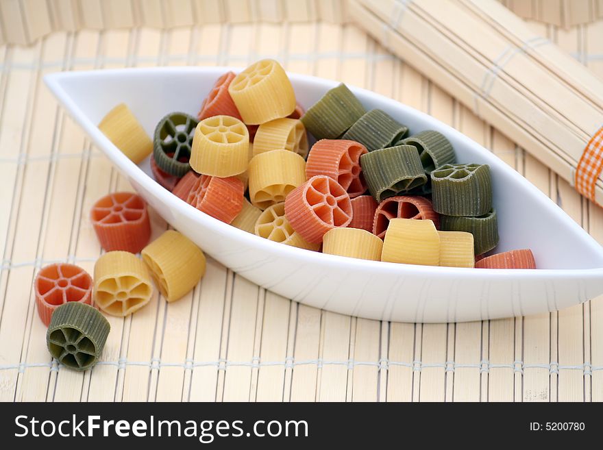 Italian pasta tricolore in beautiful table-ware