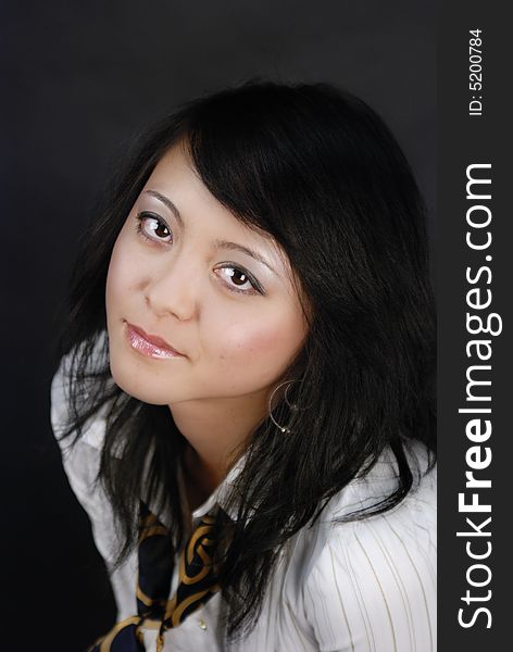 Young female model pose for portrait in a studio. Young female model pose for portrait in a studio