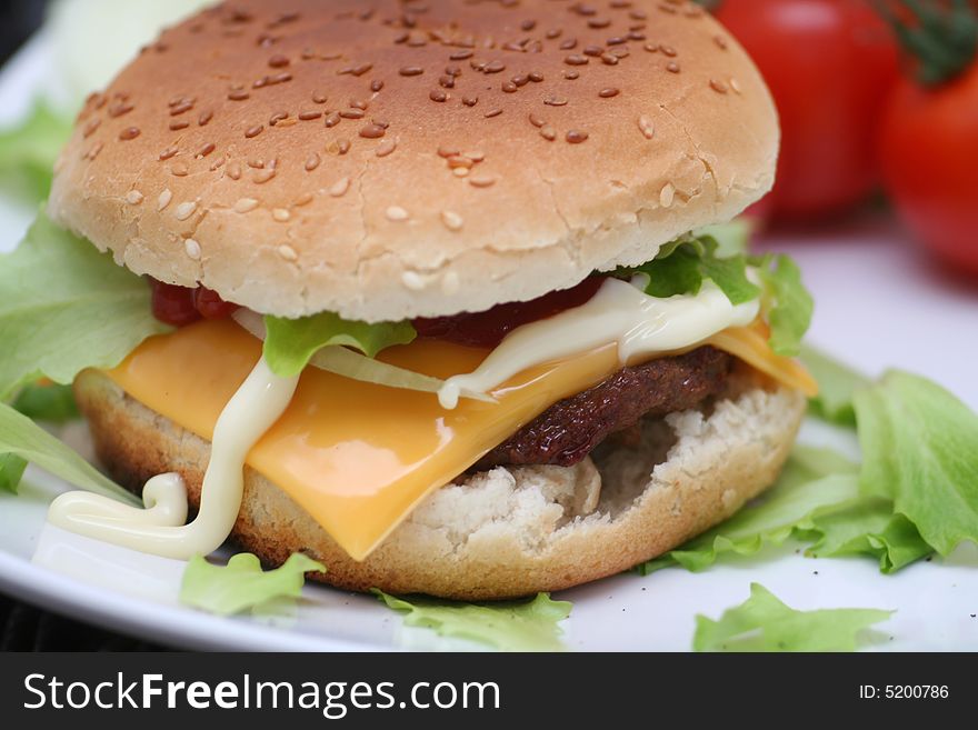 A fresh cheeseburger with meat and cheese