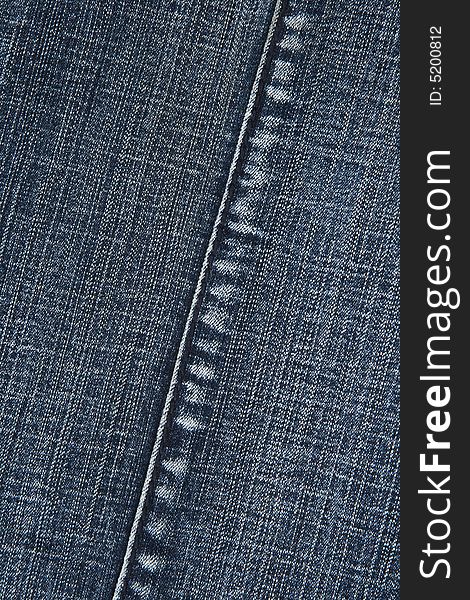 Blue denim fabric with stitch. Abstract background.