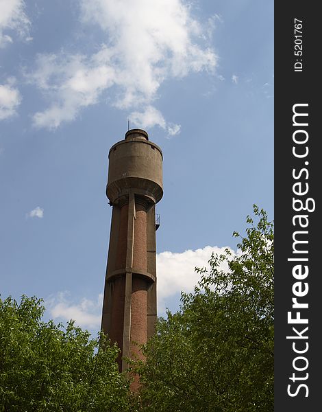 Chimney under white cloudscape in summer times. Chimney under white cloudscape in summer times