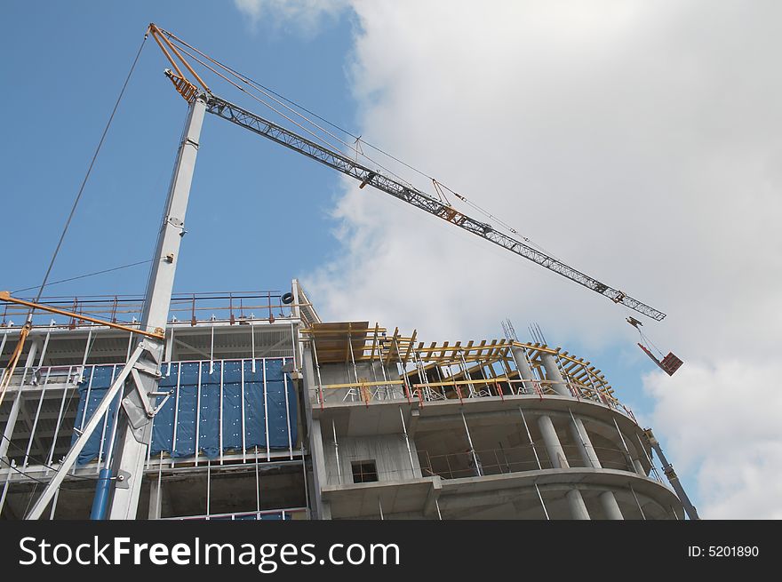 Crane with remote control in building. Crane with remote control in building