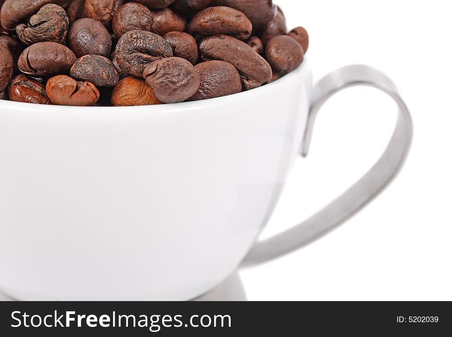 Cup of coffee beans isolated on white background