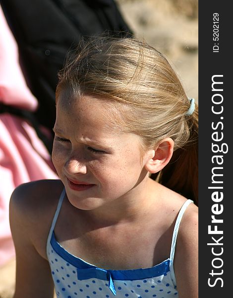 A white caucasian girl child crying with a sad expression on her face. A white caucasian girl child crying with a sad expression on her face