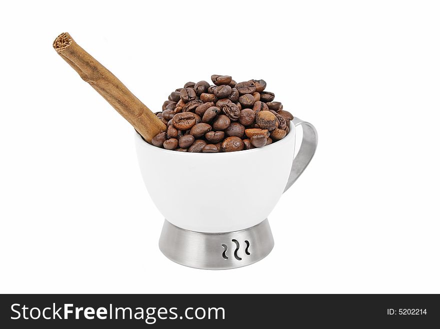 Cup of coffe beans and cinnamon stick on white background. Cup of coffe beans and cinnamon stick on white background