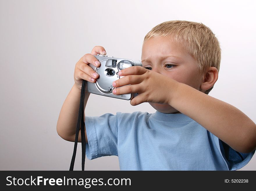 Young photographer busy taking photos