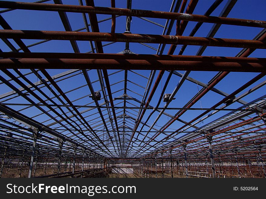 Abandoned metal warehouse structure with lines. Abandoned metal warehouse structure with lines