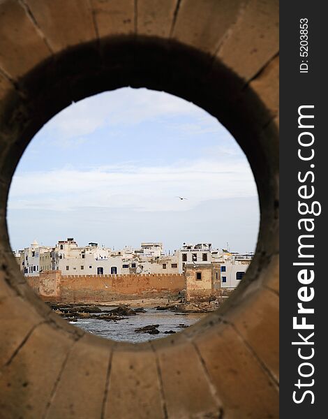 Moroccan view through the harbour wall Essaouira