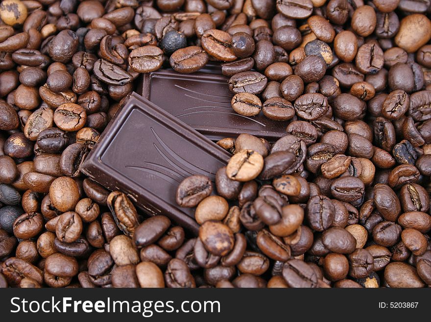 Chocolate and coffee beans closeup. Chocolate and coffee beans closeup