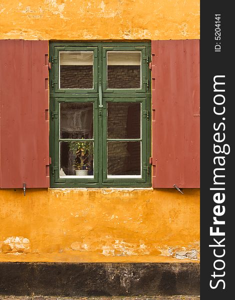 Window of a colorful rustic cottage. Window of a colorful rustic cottage