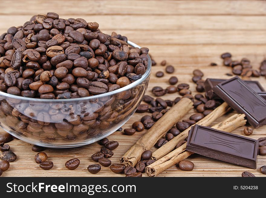 Coffee beans, cinnamon sticks and chocolate. Coffee beans, cinnamon sticks and chocolate