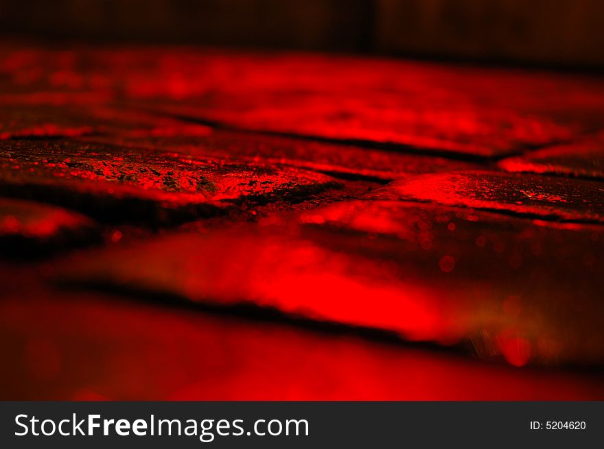 Old red pavement by night