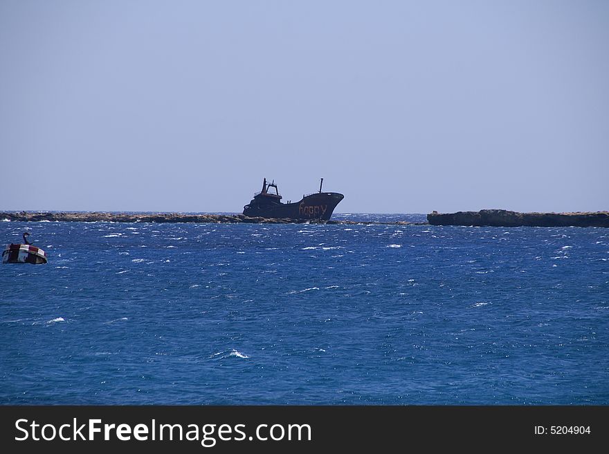 Abandoned ship washed ashore, Karpathos island, Greece. No matter what the name says, I don't think it is very happy.