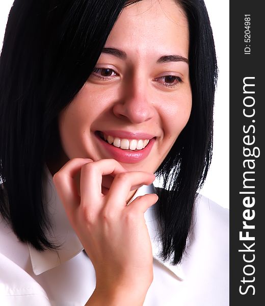 A portrait about a young pretty businesswoman with black hair who is laughing and she wears a white shirt and a black tie. A portrait about a young pretty businesswoman with black hair who is laughing and she wears a white shirt and a black tie