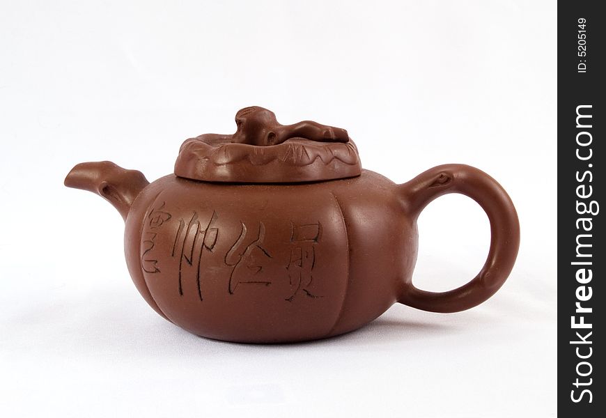 Chinese ceramic teapot decorating hieroglyphs on white background. Chinese ceramic teapot decorating hieroglyphs on white background