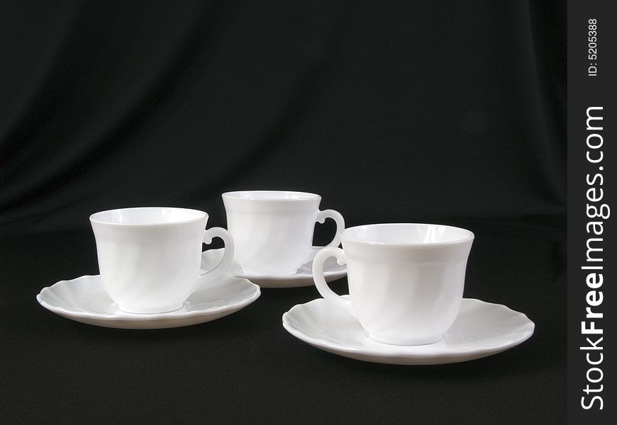 White coffee cups  on black background. White coffee cups  on black background