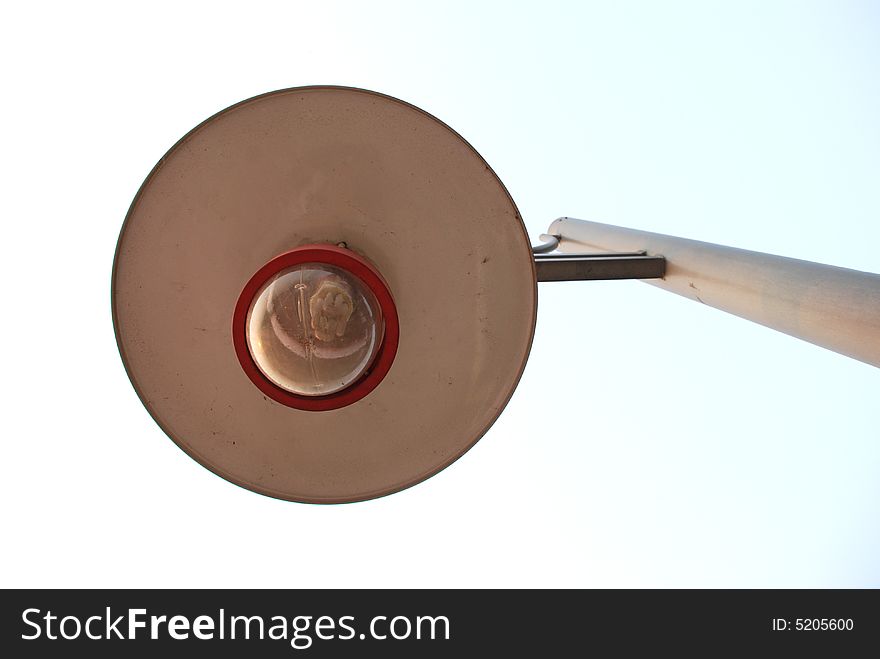 The street lamp, a bulb and a white cap.