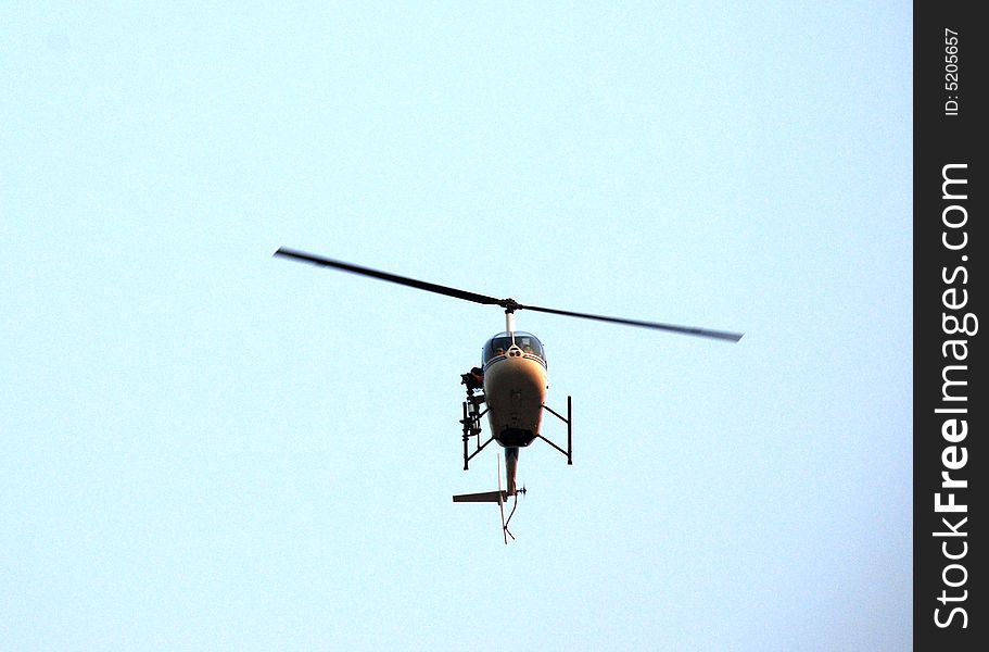 A Helicopter Flying In The Sky