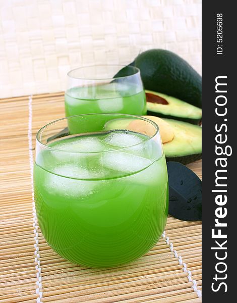 Avocado and avocado juice in a glass