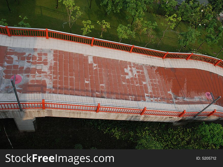 The upward footpath bridge attached to a big modern bridge.