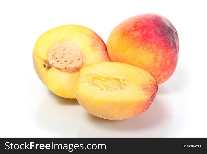 Two fresh peach on white background