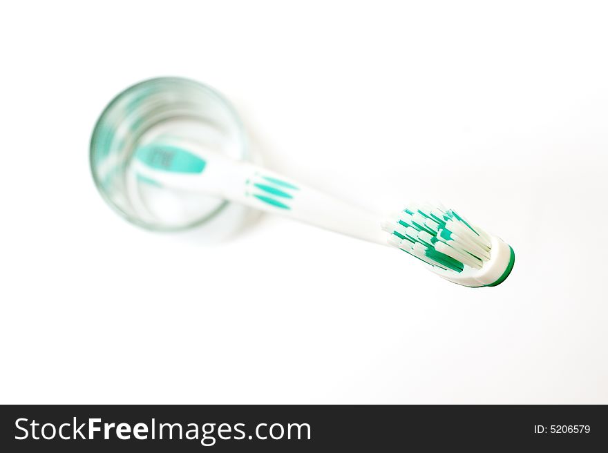 Green toothbrush isolated over white