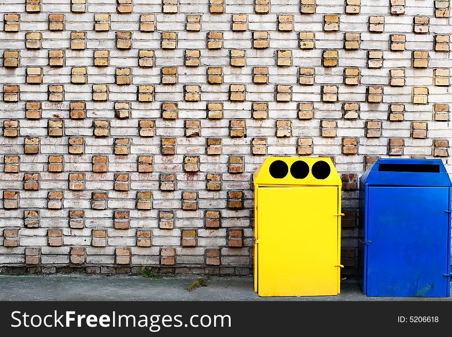 Yellow and blue garbage cans