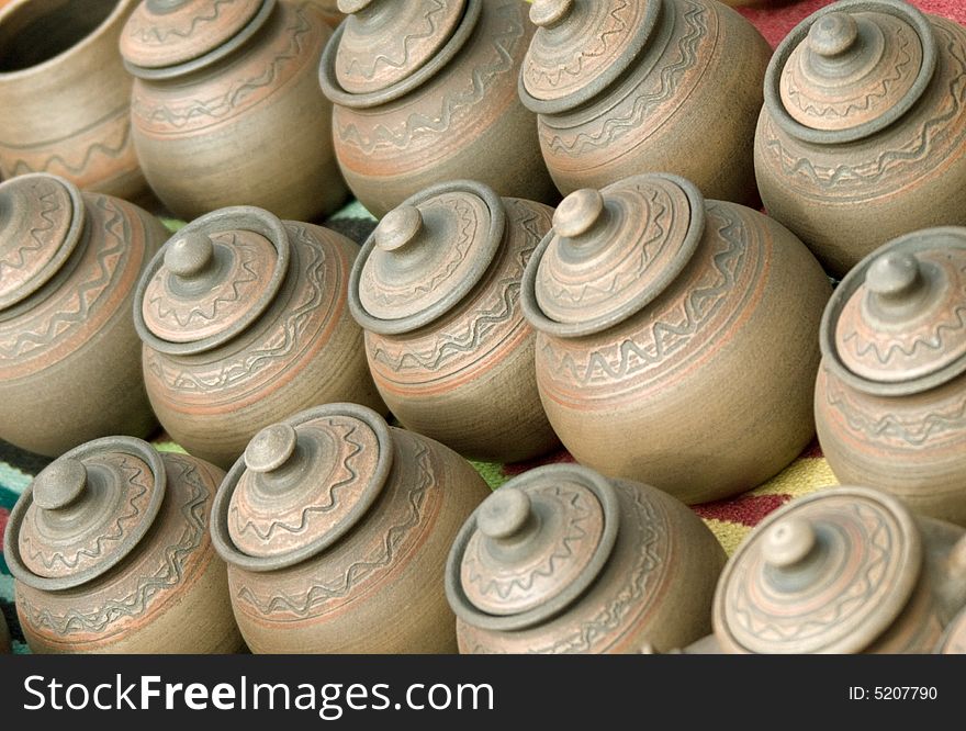 Handmade clay pots on ethnic market.