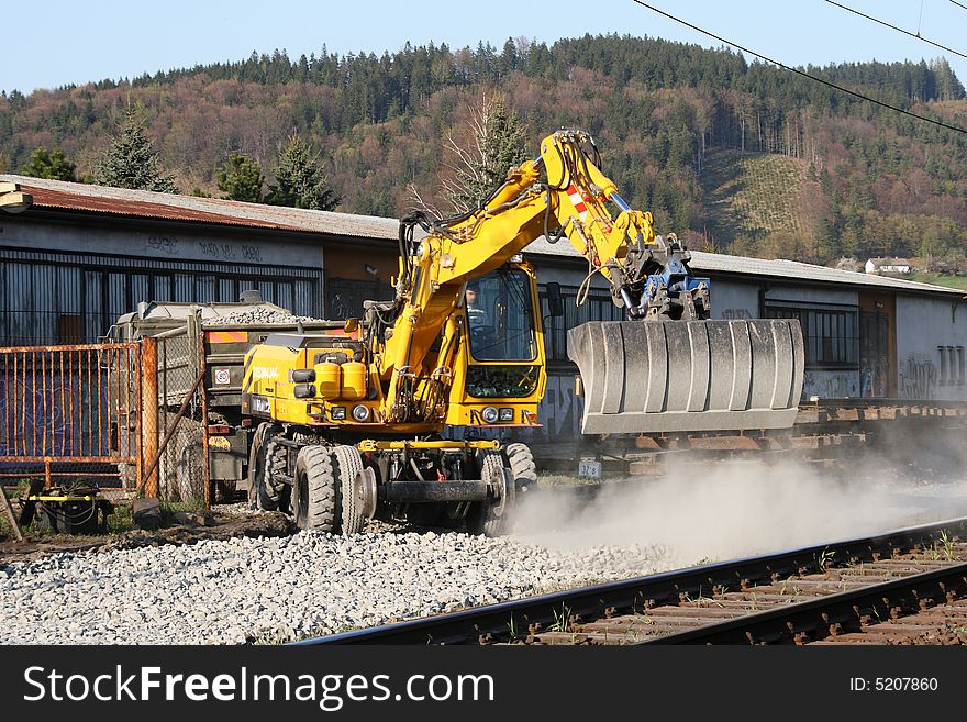 Excavator during work on railway line.