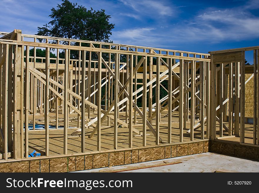 Shot of a home in various stages of construction. Shot of a home in various stages of construction