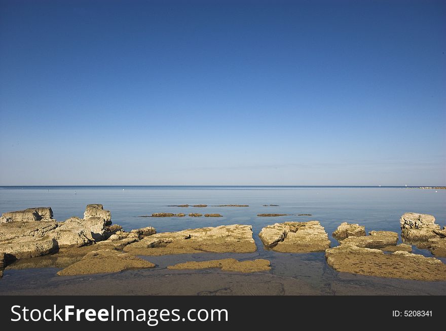 Rocky croatian beach in the area of Umag, Adriatic sea